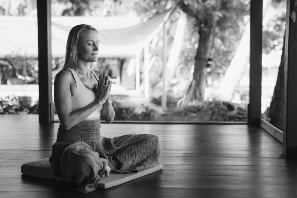 Individual practicing breathwork in a serene environment, illustrating stress relief techniques for busy lives