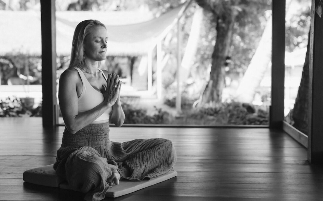 Individual practicing breathwork in a serene environment, illustrating stress relief techniques for busy lives